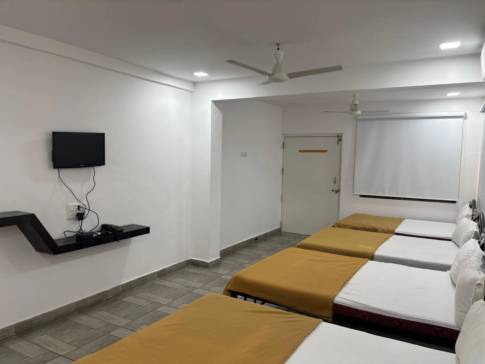 Large AC Family Room with multiple beds, perfect for group stays at Raj Resort Palghar